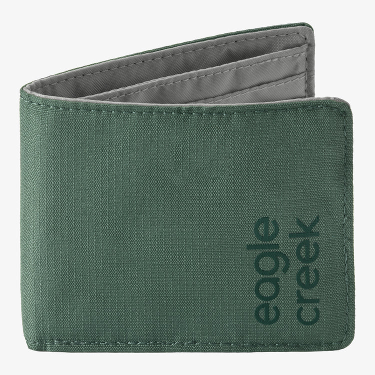 A dark green bifold wallet with a textured canvas exterior and a gray interior lining, featuring the 'eagle creek' brand name printed vertically on the lower right side.