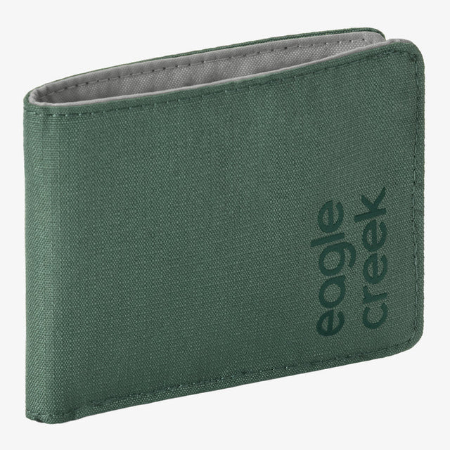 A green canvas bifold wallet with the 'eagle creek' brand name printed vertically on the front, shown against a plain white background.