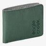 A green canvas bifold wallet with the 'eagle creek' brand name printed vertically on the front, shown against a plain white background.