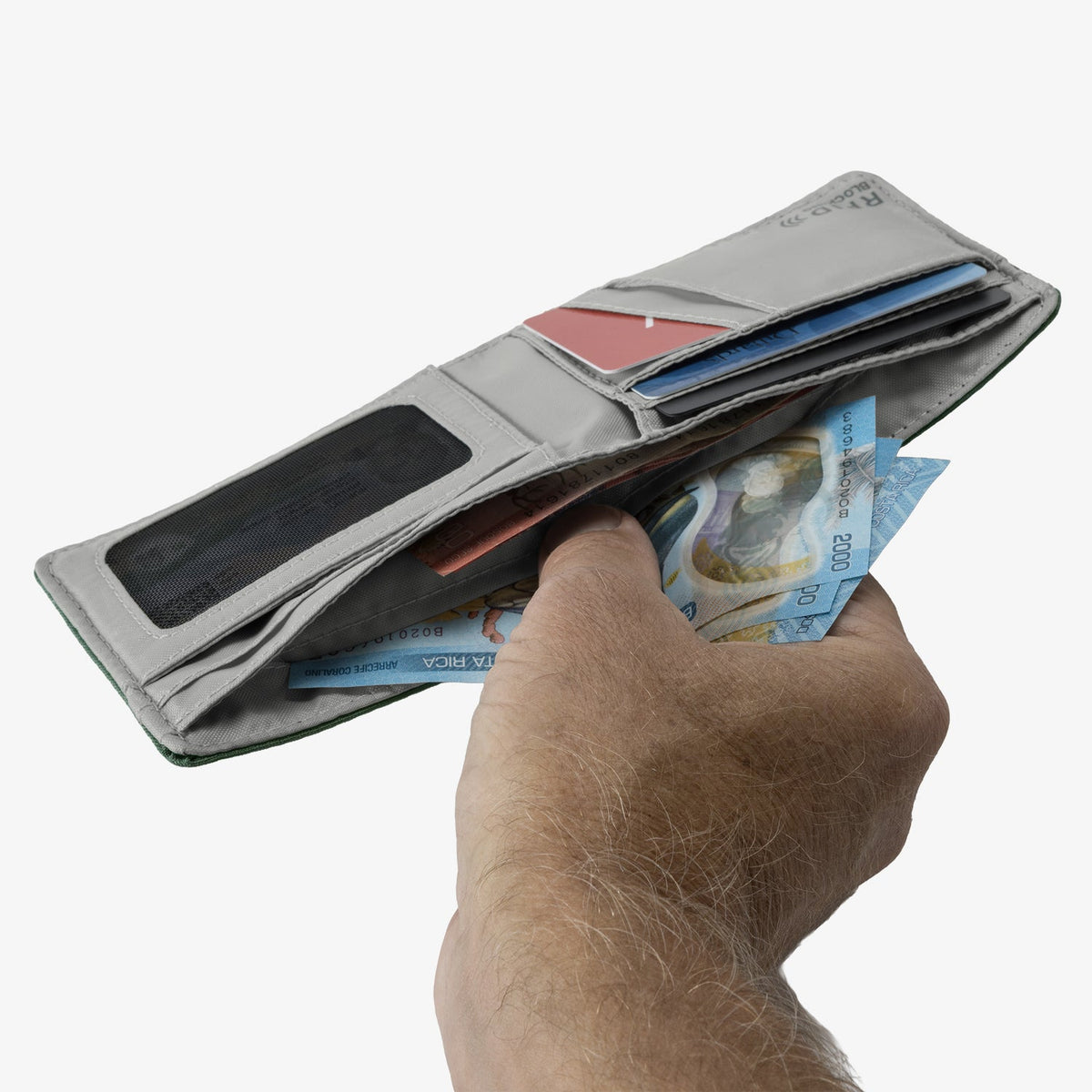 Hand holding a wallet with money and cards