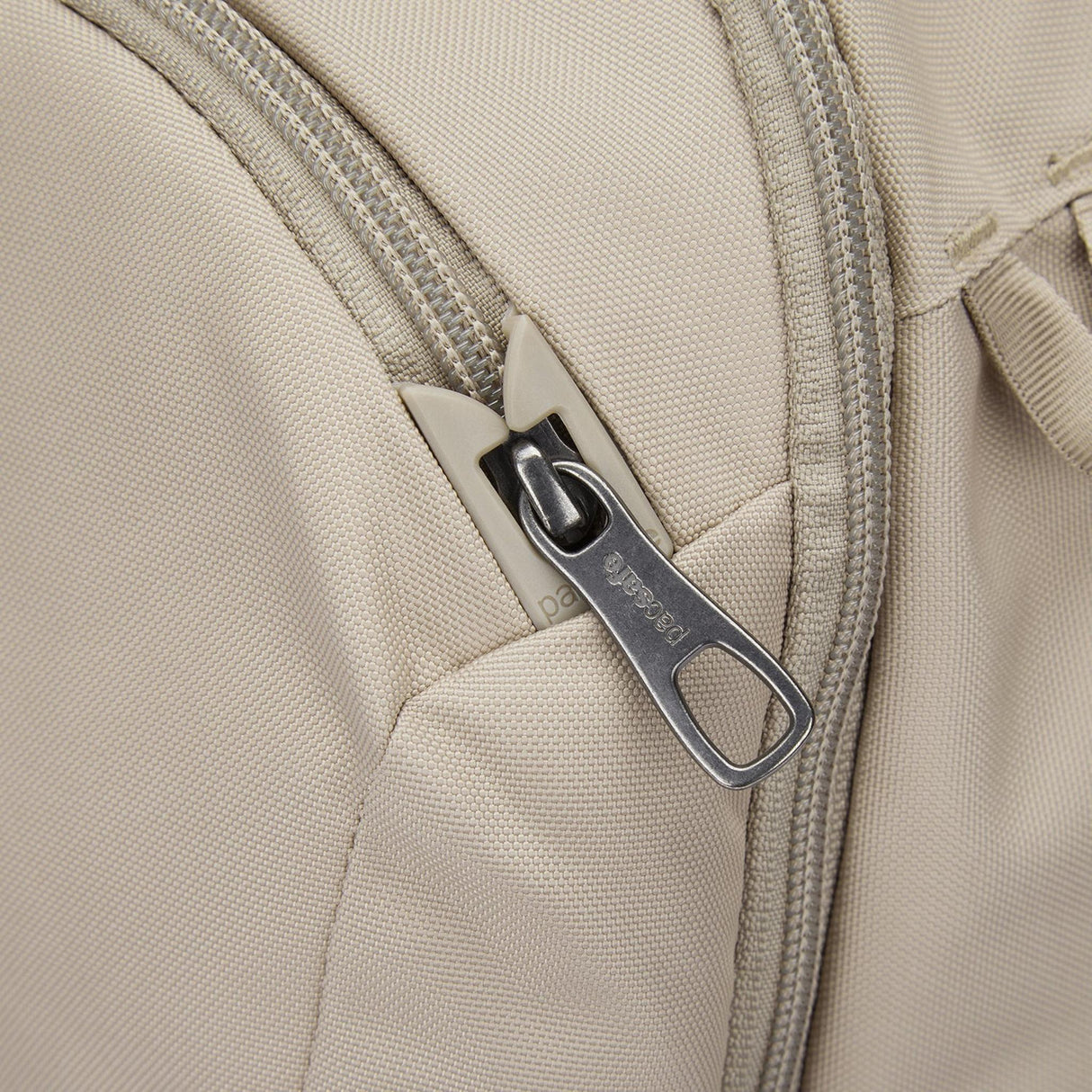 https://cdn.shopify.com/s/files/1/0041/7638/0013/files/PacsafeV_26LTourBackpack_61125237_Beige_11.jpg?v=1769989499